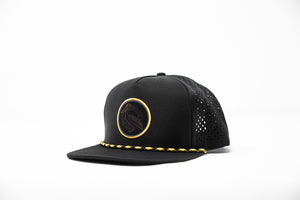 Black hat with woven patch on white background