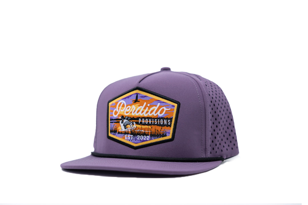 A purple 5-panel snapback cap with a logo on the front.