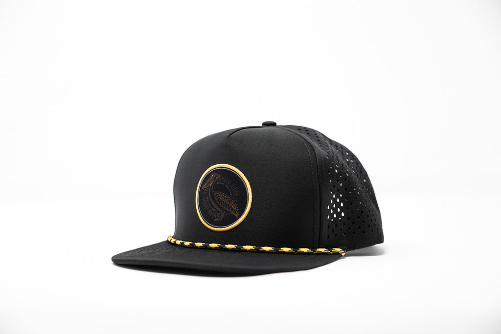 Black hat with woven patch on white background
