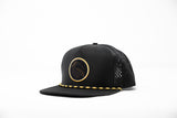 Black hat with woven patch on white background