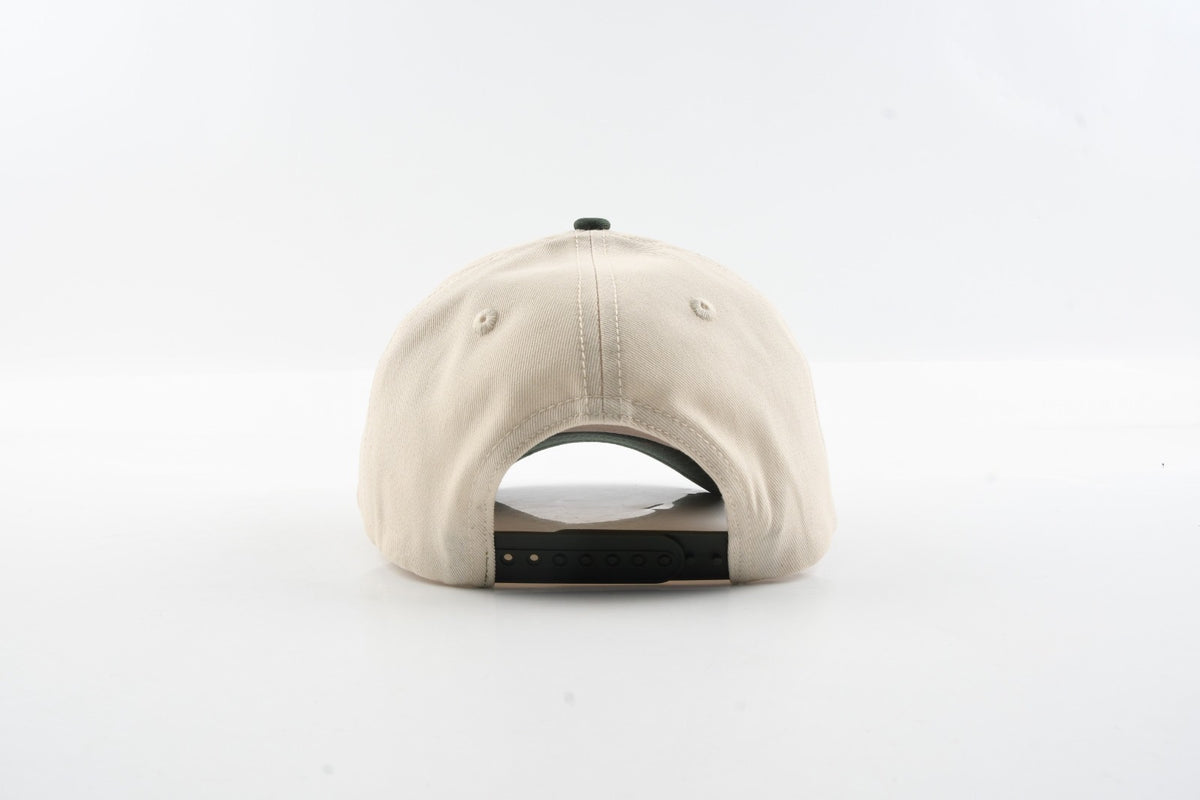 Back view of The Emily hat showing tan cotton panels and dark snapback closure.