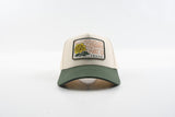 Front view of The Emily hat with green brim and yellow rose woven patch.