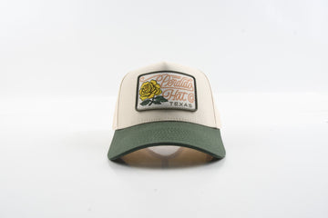 Front view of The Emily hat with green brim and yellow rose woven patch.