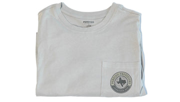 Folded gray t-shirt with a front pocket and speckled trout illustration.