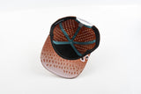 Underside view of The Rojo hat showing patterned underbrim and interior sweatband.
