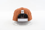 Back view of The Rojo rust hat with white snapback closure.