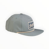 Angled side view of The Henry grey unstructured performance hat.