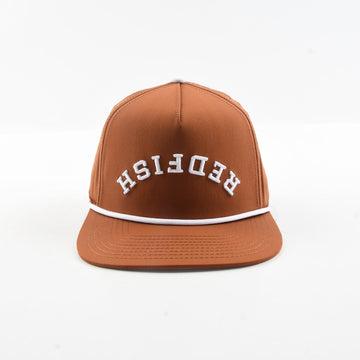 Front view of The Rojo rust brown snapback hat with white rope and arched Redfish lettering.